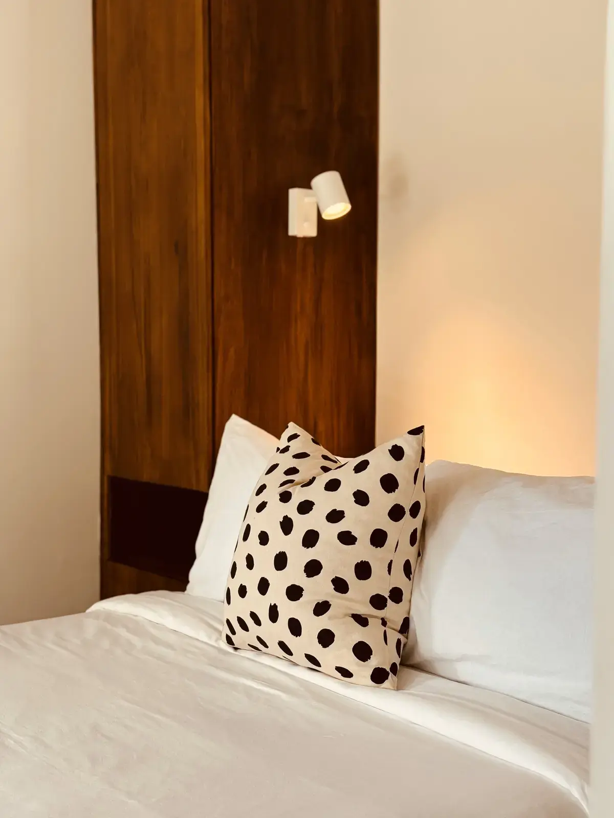 Interior view of Suite 4 bedroom with wooden slat wall